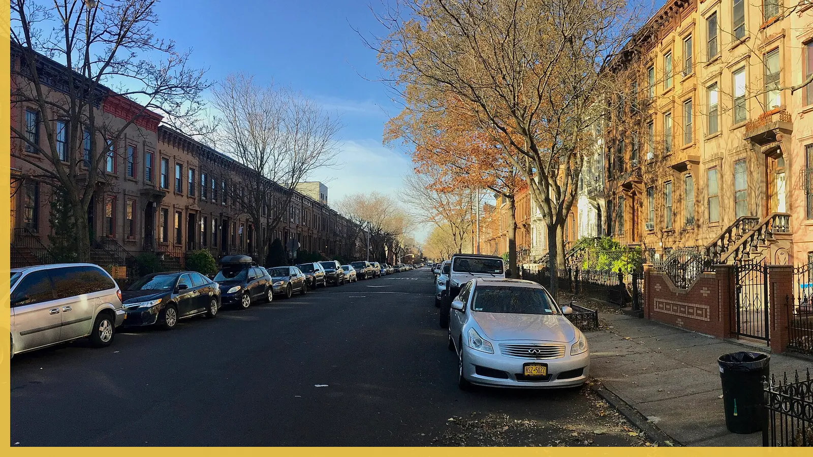 A Brooklyn neighborhood streetscape illustrating brownstones in Bed-Stuy